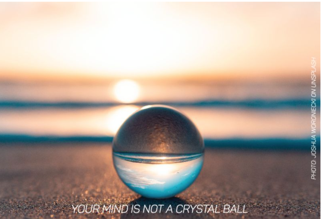 Picture of a crystal ball on a beach reflecting an ocean with caption "Your mind is not a crystal ball."
